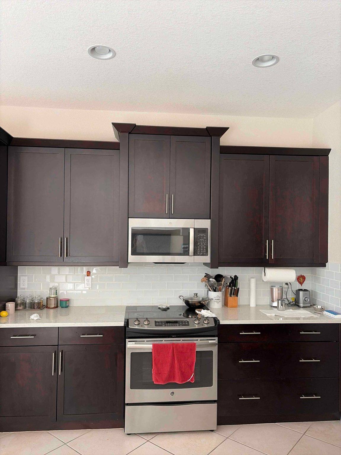 Cabinet painting before and after - Naples, FL