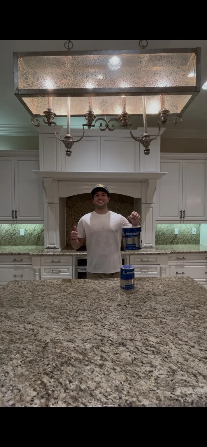 Hawkeye Painting owner with Renner 2K cabinet coatings at Riverstone project